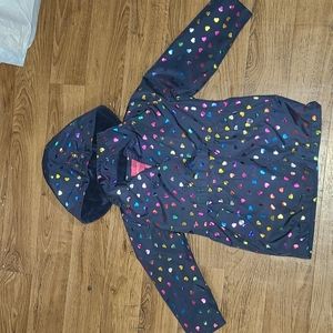 A zip down rain jacket with buttons